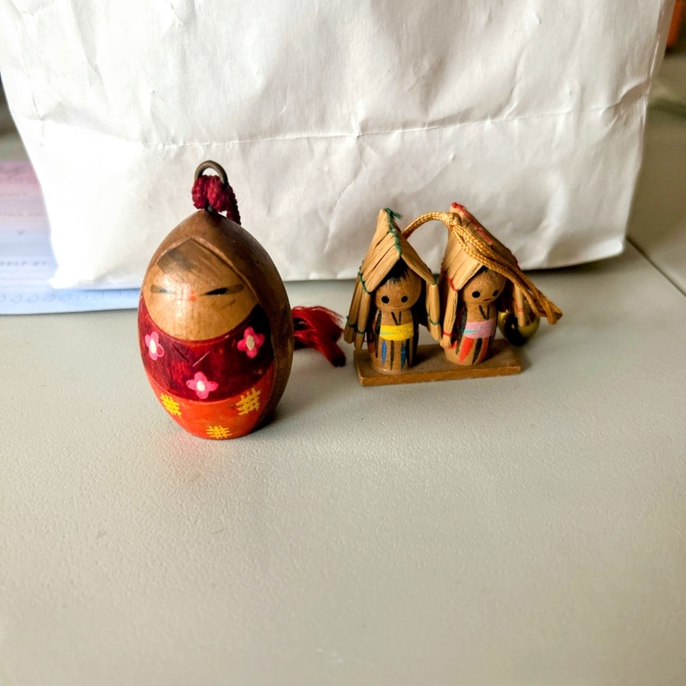 Two wooden Kokeshi bell dolls